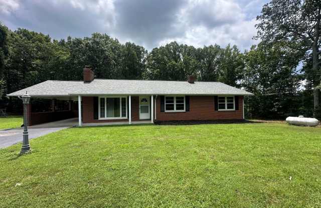 Spacious brick house with a caport and unfinished basement photos photos