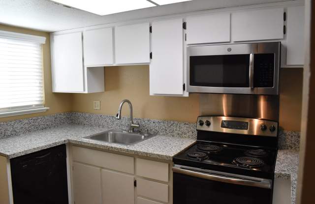 Condo unit featuring updated kitchen with granite counter tops and newer LVT flooring! photos photos