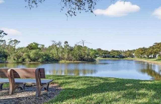 Beautifully Renovated Coach Home in Barbados at Tarpon Cove – Lake & Preserve Views! Gated Community | 2 Bedrooms + Cozy Den | 2 Bathrooms | Attached 1-Car Garage | 1,684 Sq. Ft. | Optional Club Membership Gallery 1