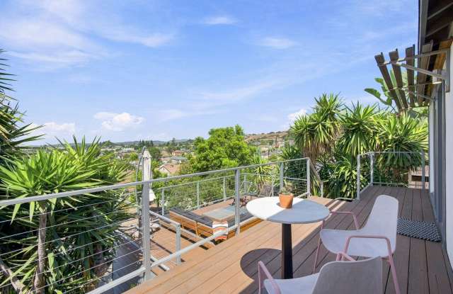 Charming Hillside Retreat with Modern Upgrades, Stunning City Views & Expansive Outdoor Living! Gallery 4
