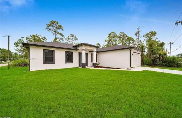 1006 W 10TH ST - 1006 West 10th Street, Lehigh Acres, FL 33972