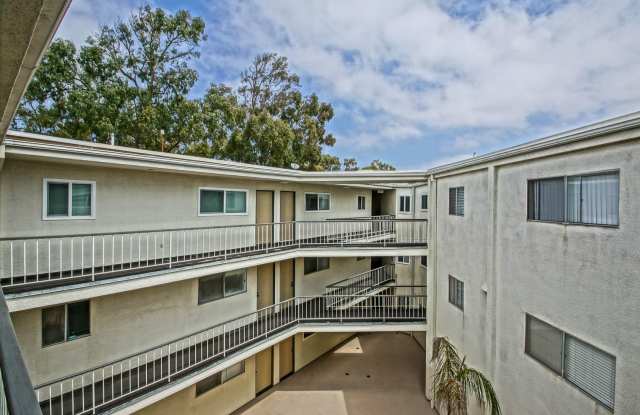 Bright  Spacious, Top-Floor 3BR3BA Condo w/ Spacious Deck w/ City Views, 2-Car Parking  In-Unit Laundry Next to Wilderness Park, Shopping, Schools, Park  Just 2 Mins to Beach! photos photos