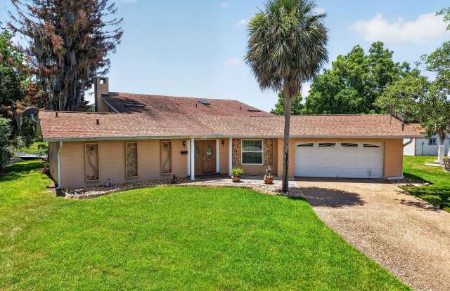 Available Now! Unique Canal-Front Pool Home with Boathouse & Chain of Lakes Access photos photos