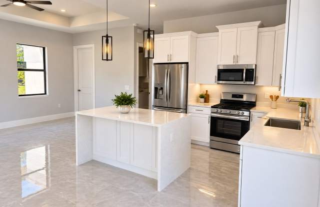 Brand-New Pool Home with a Legal Mother-in-Law Suite in Lehigh Acres FL! Gallery 3