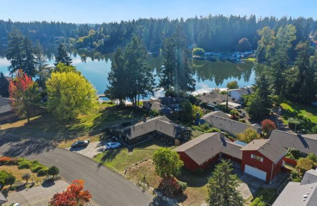 MOVE IN READY NOW! Peek a boo view of Pattison Lake - 3 bedrooms plus huge bonus room - bring your home business! Gallery 3