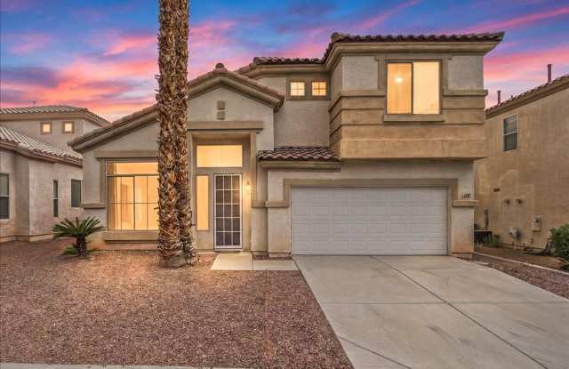 Contemporary Guard-Gated Retreat Near Rhodes Ranch Golf Club with Elegant Open-Concept Living photos photos