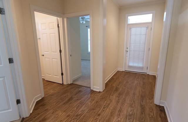 Introducing a charming 3 bedroom 3 bath townhouse located in the desirable community of Magnolia Greens Gallery 4