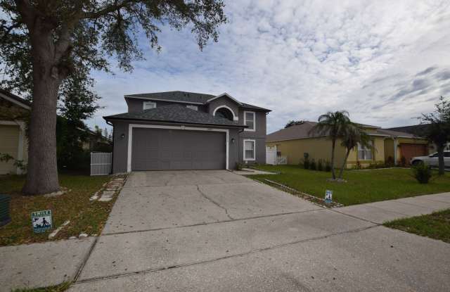This charming 4-bedroom, 2.5-bathroom single-family home for rent at 16053 Wilkinson Dr. Clermont, FL 34714 Gallery 1