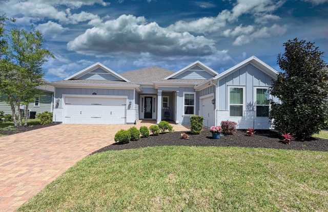 tunning lakefront home featuring 4 bedrooms 3.5 bathrooms & over 3,000 square feet of living space, plus a 3-car garage, office & attached guest house photos photos