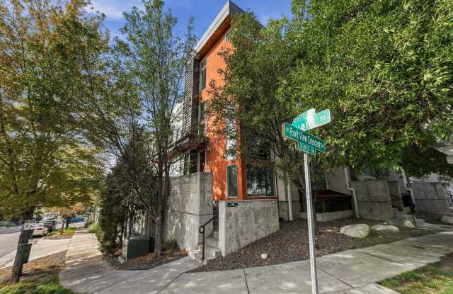 Great location with 3 sides of windows and HUGE rooftop! Gallery 3