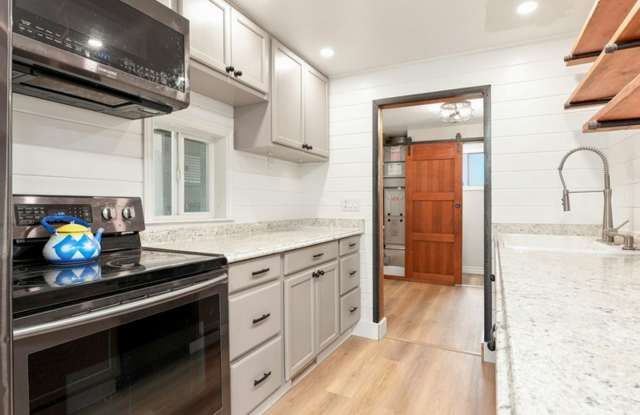 Updated Rambler with covered patio and large detached garage. Gallery 4