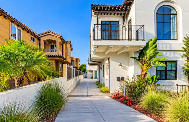 Upscale & Spacious, Spanish Style Tri-Level Townhome w/ Amazing Great Room Living Space, Rooftop Deck, 2 Balconies, Rear Yard & 2-Car Garage Close to Schools, Shopping & Just 2 Blocks to MB Border & 5 Mins to Beach! Gallery 3