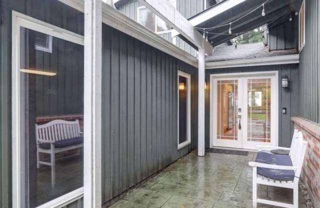 Mercer Island: 5-Bed, 4-Bath Home with Water Views, Large Yard, Updated Kitchen, Private Primary Suite Gallery 4