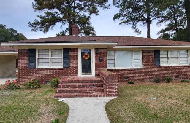 3 Bedroom 1 1/2 Bath Ranch style brick home with attached carport. - 704 West 27th Street, Lumberton, NC 28358
