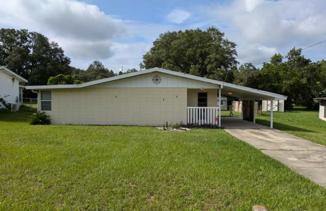 2/2 fenced in yard located in RAINBOW LAKE ESTATES - 21696 Southwest Raintree Street, Marion County, FL 34431