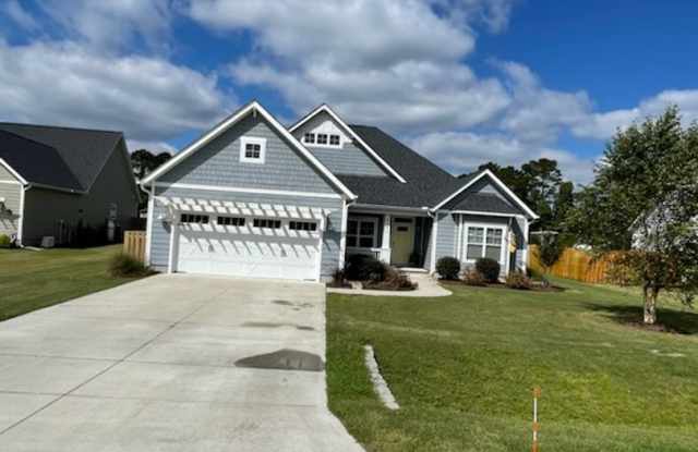 Welcome to this charming 3-bedroom, 2-bathroom home located in the desirable area of Leland, NC. photos photos