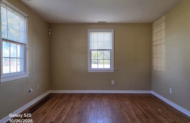 Cape Cod in Southside on large corner lot with private back yard. Gallery 3