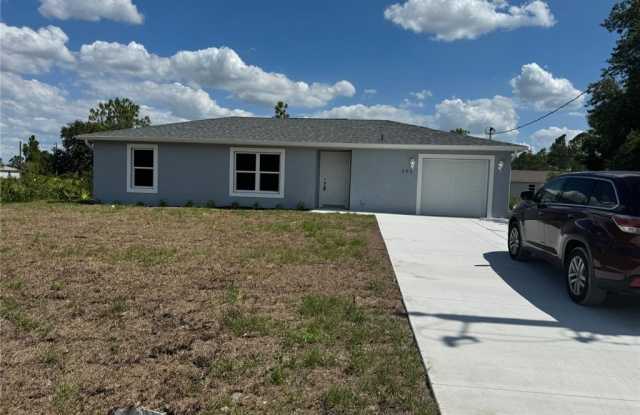 565 Merrywood Avenue - 565 Merrywood Avenue, Lehigh Acres, FL 33972