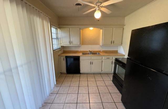 Lots of character, wood vinyl flooring and carpet, large, fenced yard, ready for move in! Gallery 3
