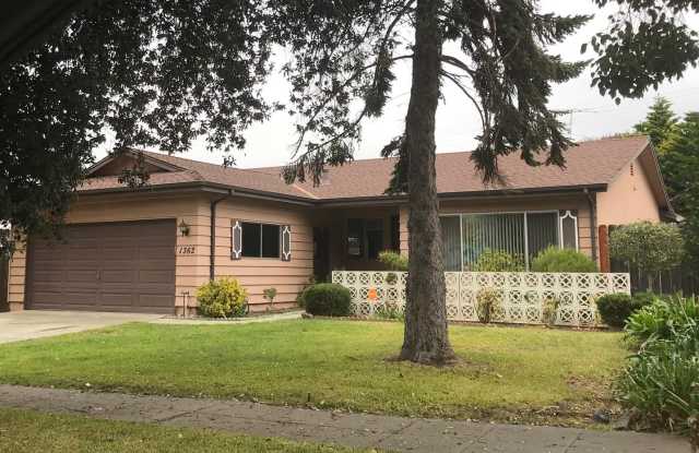 Home adjacent to park with new paint and new carpet plus garage and lemon tree in yard photos photos