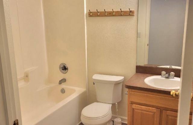 Well Laid Out 4 Bed/ 2 Baths with large Living/Dining and Vinyl Floors throughout on Partially Fenced Yard. Charming! Gallery 1