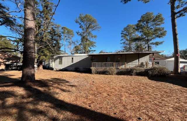 Welcome to this charming 2-bedroom, 1.5-bathroom home located in the desirable area of Leland, NC photos photos