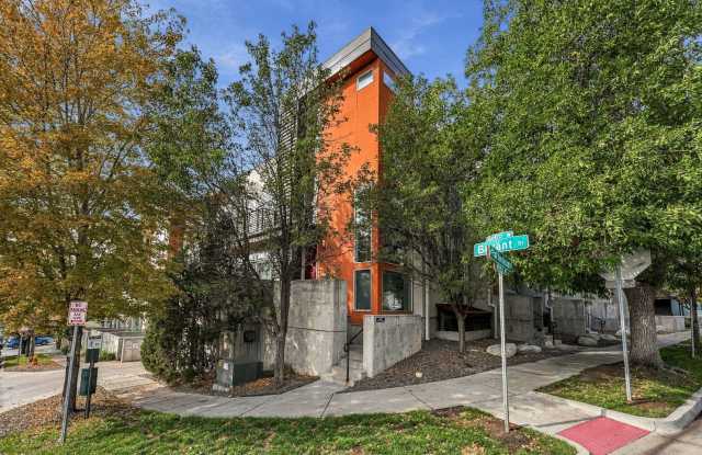 Great location with 3 sides of windows and HUGE rooftop! Gallery 1