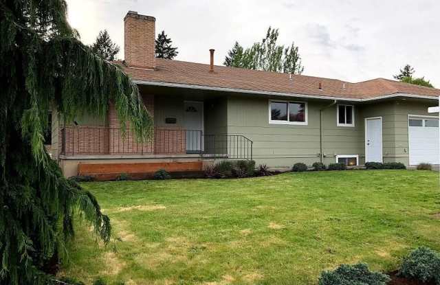 Spacious 4 Bedroom Home with Granite Kitchen, Main-Level Primary Suite, Two Living Areas & Outdoor Patio Gallery 1