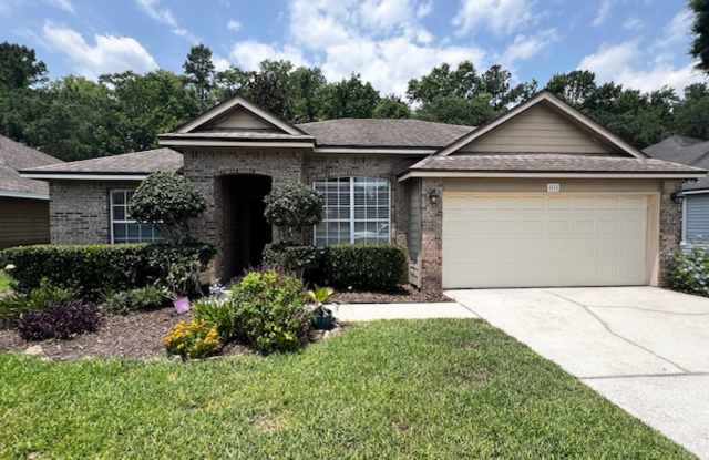 Welcome to this charming 3-bedroom, 2-bath home in Woodland Forest. photos photos