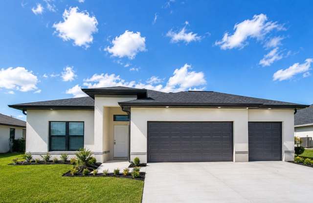 Brand-New Luxury Home with 3-Car Garage & Lawn Care Included | Modern Living in Cape Coral! photos photos