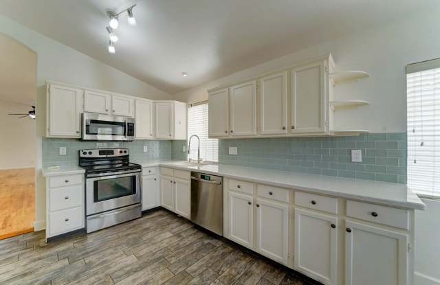 AVAILABLE FOR IMMEDIATE MOVE-IN!  Bright, open-concept Ahwatukee home with beautiful wood flooring. Tour today, move in right away! photos photos