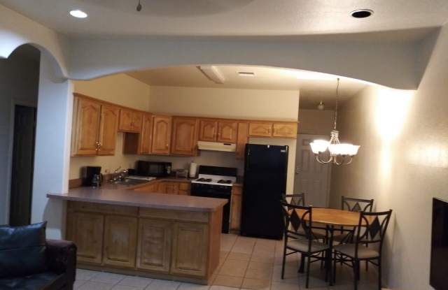 Modern town home with AC. 3/2. Covered, off-street parking, easy care yard.  Ample kitchen. Laminate and tile floors. Gallery 3