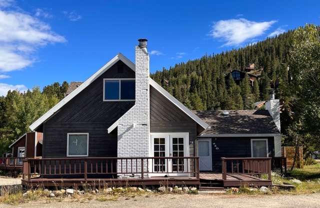 BRECK two living spaces! Fenced backyard! Bus route! Community hot tubs, pool, sauna, volleyball court, and tennis courts! Gallery 1