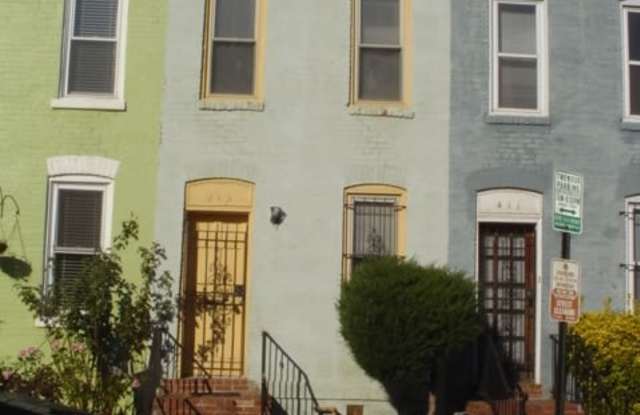 A charming two bedroom one and one half  bath row house located just off New Jersey Ave in the Shaw Neighborhood! photos photos