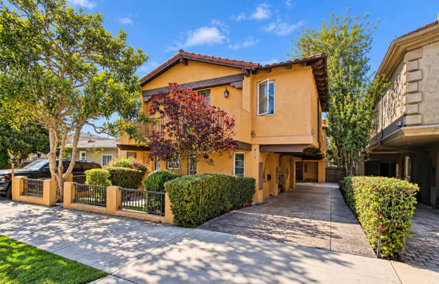 SPACIOUS & SECLUDED, SPANISH MEDITERRANEAN REAR UNIT TOWNHOUSE W/ LARGE ROOFTOP DECK W/ OCEAN/PV VIEWS, 2 BALCONIES, WRAP AROUND YARD & 2-CAR GARAGE ON CUL-DE-SAC STREET CLOSE TO SCHOOLS, SHOPPING, RB PIER & BEACH! Gallery 1