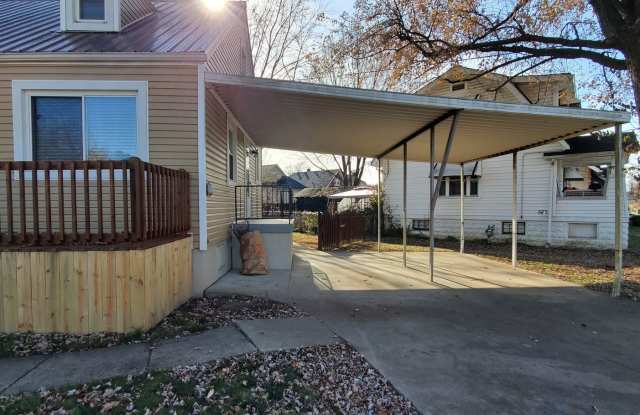 CLEAN and Updated Dollhouse!  3 Bedrooms, 1 Bathroom, Redone Hardwood Floors, 2 Car Carport, Basement, Granite, Gas Range, Fenced Yard! Gallery 4