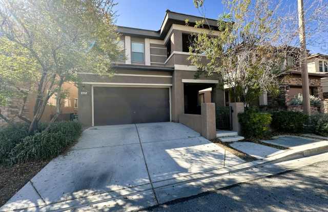 Beautiful 4 bedroom Summerlin home with balcony view of mountains! Downstairs the open floor plan living room, large kitchen, and separate dining area make the home perfect for entertaining and families! - 10375 Mystic Pine Road, Summerlin South, NV 89135