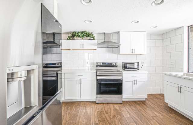 Gated 3-Bedroom Townhome with Fireplace, Patio & 2-Car Garage Gallery 1