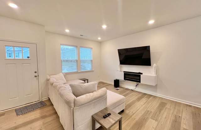 **OFFERING $50 RENT DISCOUNT PROMOTION FOR FIRST 6 MONTHS, REFUNDABLE APPLICATION FEES & $100 MOVE IN PROMOTION** Luxurious, Newly Built 3BD, 2.5BA Raleigh Townhome with Modern Features and Easy Access to I-40 and Downtown Raleigh Gallery 3