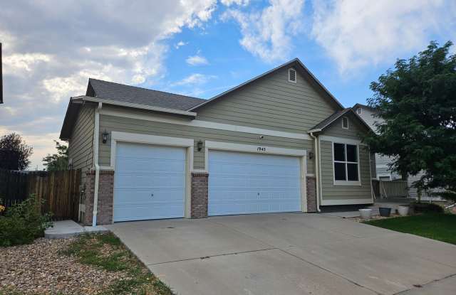 4 Bed 3 Bath Home in Strasburg with a 3 Car Garage. - 1945 Basil Street, Strasburg, CO 80136