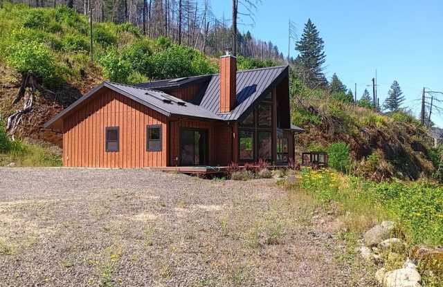 Beautiful Chalet Style Riverfront Property With Large Shop photos photos