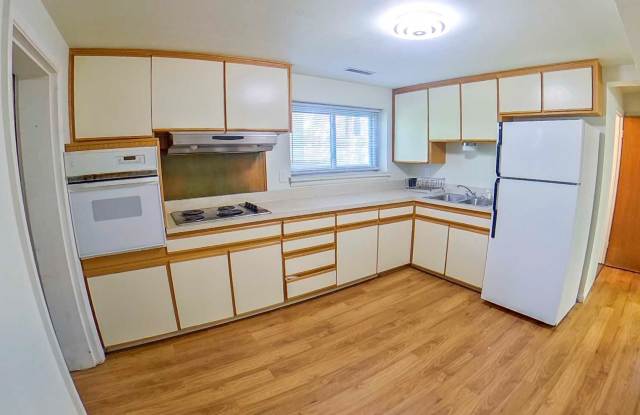 Big Backyard + Pet Friendly + Off-Street Parking + Washer and Dryer Included! + Available Now! - 2004 Strong Avenue, Manhattan, KS 66502