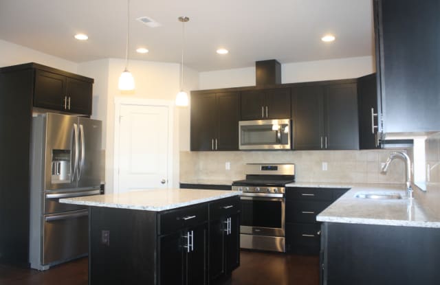 4 bdrm 2.5 bath PLUS a den/office on main, Newer home (2018), Tankless H20 heater, Upgrades galore. Dead end road for privacy Gallery 4