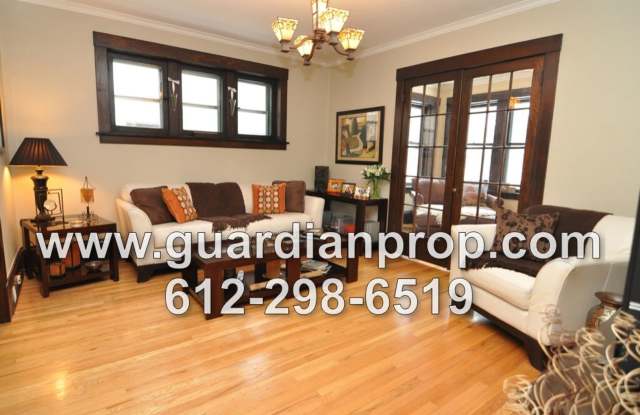 Main Floor Condo Available June 1st in Merriam Park, Original Woodwork  Built-ins, Sunroom, In Unit Laundry! photos photos