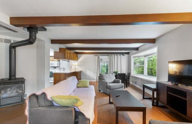 Home-Like Living with Sunroom, Attached Garage & In-Unit Laundry Gallery 1