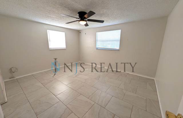 NEW renovation 2 bed/1 bath ~NEW: tile floors, kitchen renovation & paint! with a HUGE fenced yard!! Gallery 4