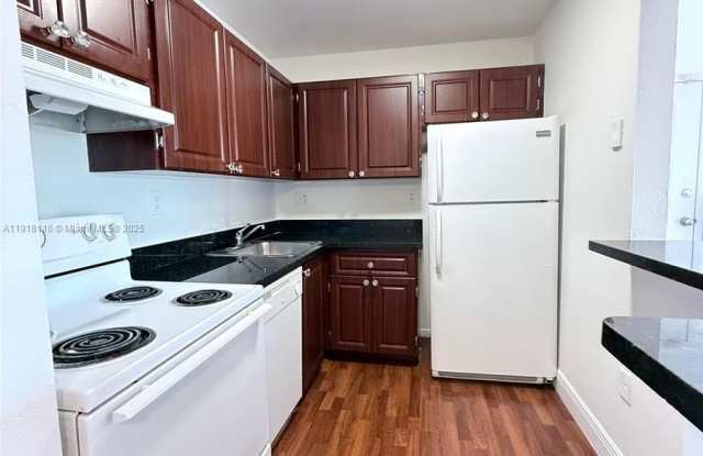 7100 NW 179th St - 7100 Northwest 179th Street, Country Club, FL 33015