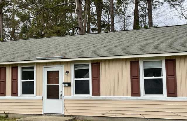 Charming two bedroom one bath duplex that is centrally located! Just minutes from area bases, shopping, restaurants, and beaches. All pets must be approved by the owner NO CATS. Owner will only accept 2 dogs. photos photos
