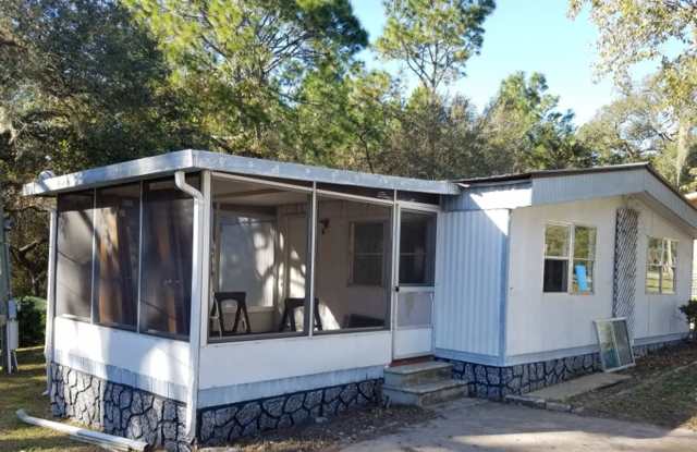 Freshly painted spacious 2-bedroom 1-bath home with a screened porch and storage shed. photos photos