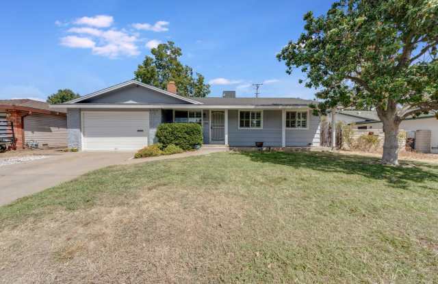 Updated 3-Bedroom Home! Modern Kitchen, Cozy Fireplace and Large Backyard! photos photos